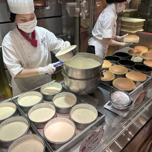 Assembly line of Japanese soufflé cheesecake